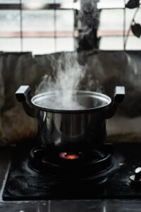 Boiling pot of water on top of a stove